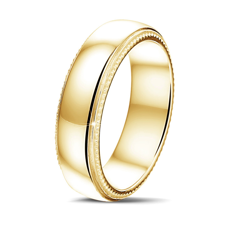 Wedding ring with a slightly domed surface of 6.00 mm in yellow gold with milgrain
