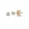 0.60 carat classic diamond earrings in red gold with four prongs