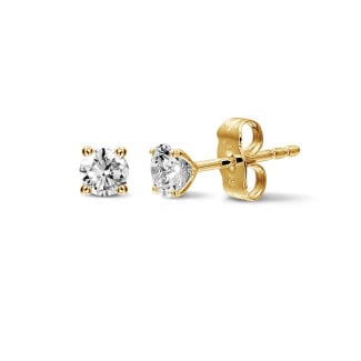 Earrings - 1.00 carat classic diamond earrings in yellow gold with four prongs