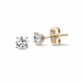 1.50 carat classic diamond earrings in red gold with four prongs