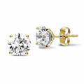 4.00 carat classic diamond earrings in yellow gold with four prongs
