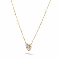 0.65 carat heart-shaped necklace in yellow gold with round diamonds