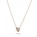 0.65 carat heart-shaped necklace in red gold with round diamonds