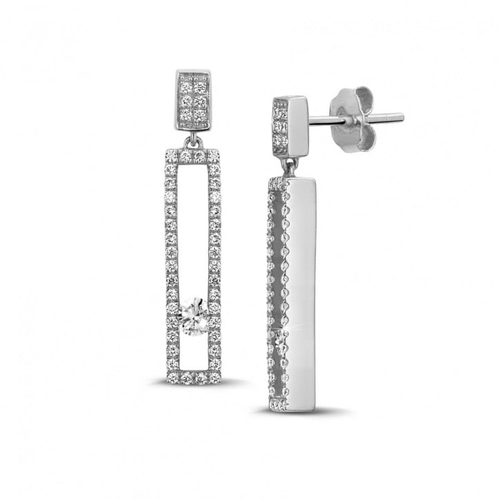 0.55 carat earrings in white gold with floating round diamonds