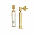 0.55 carat earrings in yellow gold with floating round diamonds