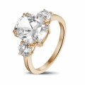 Ring in red gold with cushion diamond and round diamonds