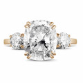 Ring in red gold with cushion diamond and round diamonds