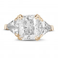 Ring in red gold with radiant diamond and triangle diamonds