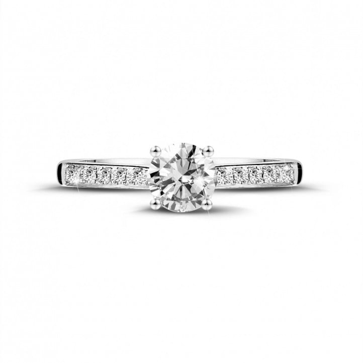 0.50 carat solitaire ring in white gold with four prongs and side diamonds
