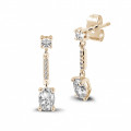 1.04 carat earrings in red gold with oval diamonds