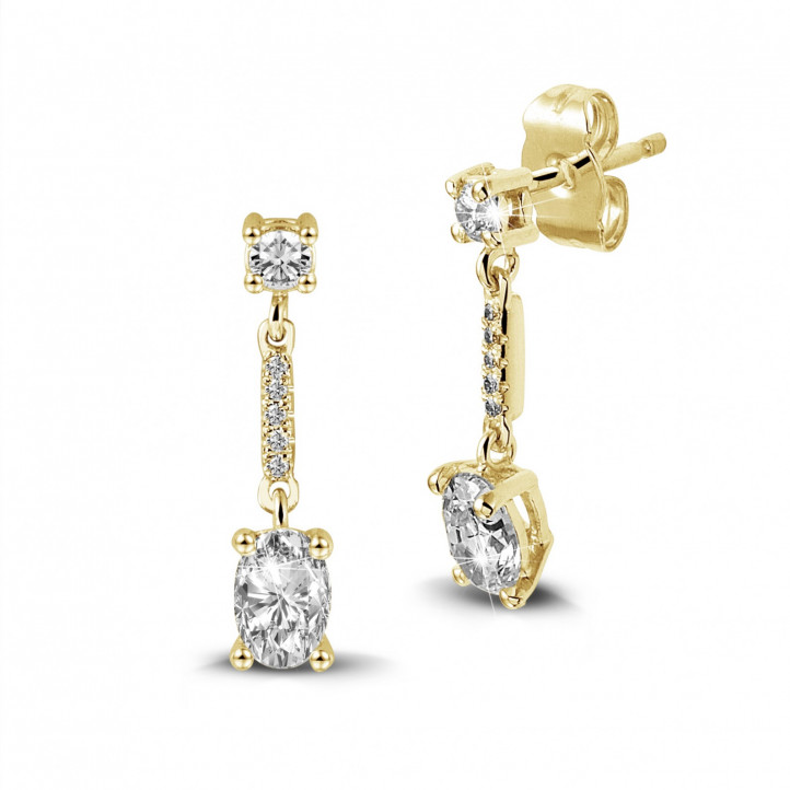 1.04 carat earrings in yellow gold with oval diamonds