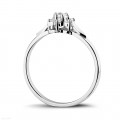 0.15 carat diamond flower ring in white gold