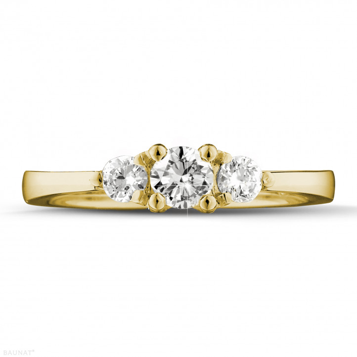 0.45 carat trilogy ring in yellow gold with round diamonds