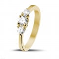 0.67 carat trilogy ring in yellow gold with round diamonds
