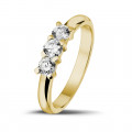 0.50 carat trilogy ring in yellow gold with round diamonds