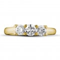 1.00 carat trilogy ring in yellow gold with round diamonds
