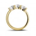 2.05 carat trilogy ring in yellow gold with round diamonds