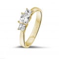 0.70 carat trilogy ring in yellow gold with princess diamonds