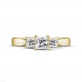 0.70 carat trilogy ring in yellow gold with princess diamonds