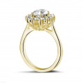 1.85 carat entourage ring in yellow gold with oval diamond