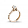 1.00 quilates anillo de oro rojo de diamantes con diamantes en los lados
