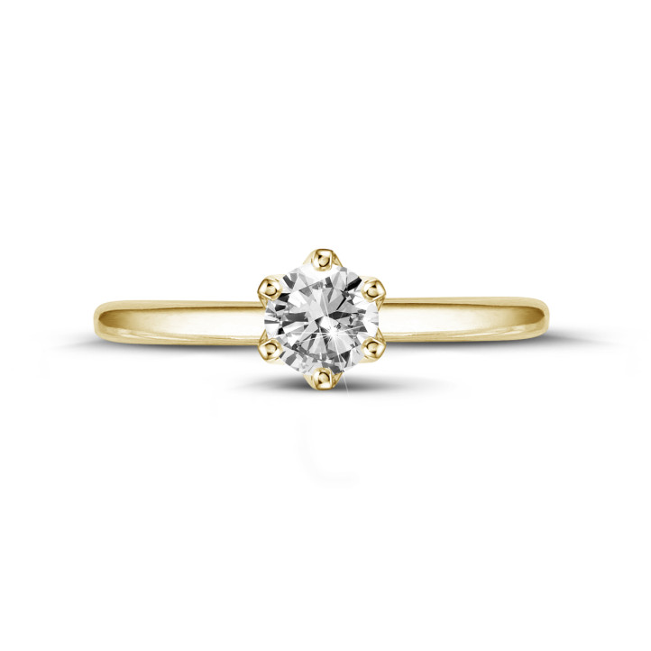 0.50 quilates anillo solitario en oro amarillo con diamante redondo