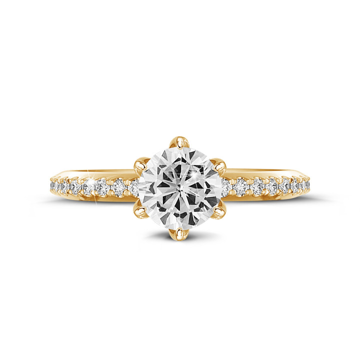 0.90 quilates anillo solitario en oro amarillo con diamantes en los lados