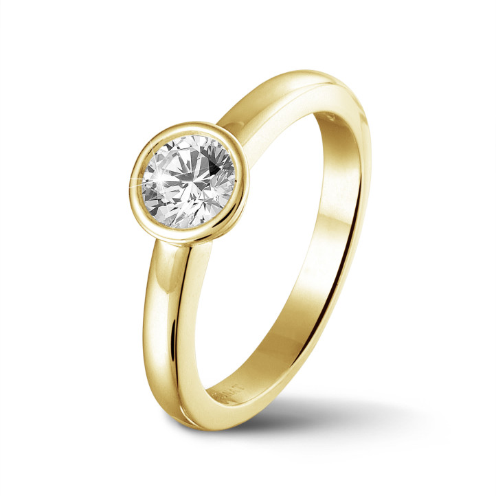 0.90 quilates anillo solitario en oro amarillo con un diamante redondo