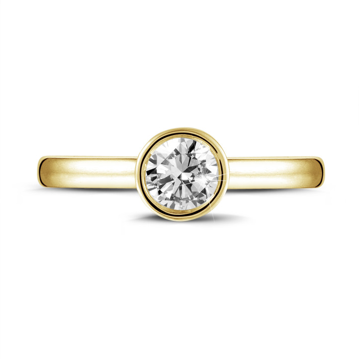 0.90 quilates anillo solitario en oro amarillo con un diamante redondo