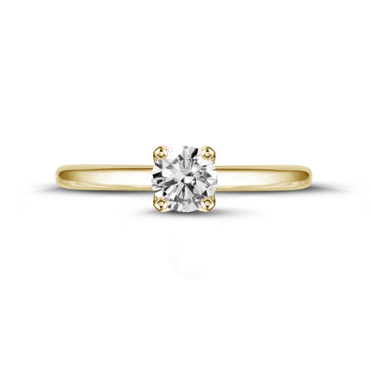 0.50 quilates anillo solitario en oro amarillo con diamante redondo