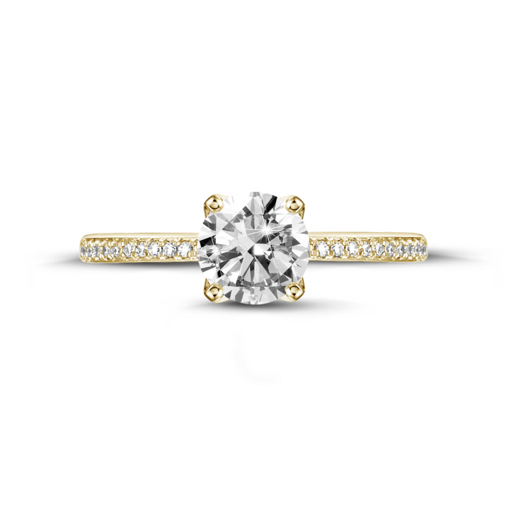 0.50 quilates anillo solitario en oro amarillo con diamantes en los lados