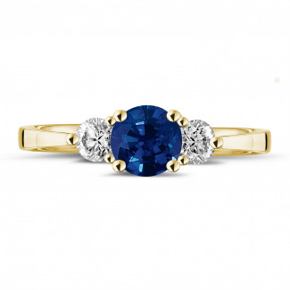 Compromiso - Anillo trilogía en oro amarillo con zafiro central y diamantes redondos