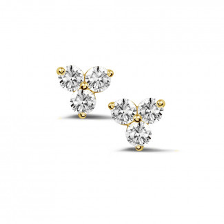 0.60 quilates pendientes diamantes trilogía en oro amarillo