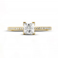 0.75 quilates anillo solitario en oro amarillo con diamante talla princesa y diamantes laterales