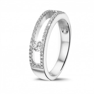 L’Atypique - 0.25 quilates anillo en oro blanco con un diamante redondo flotante