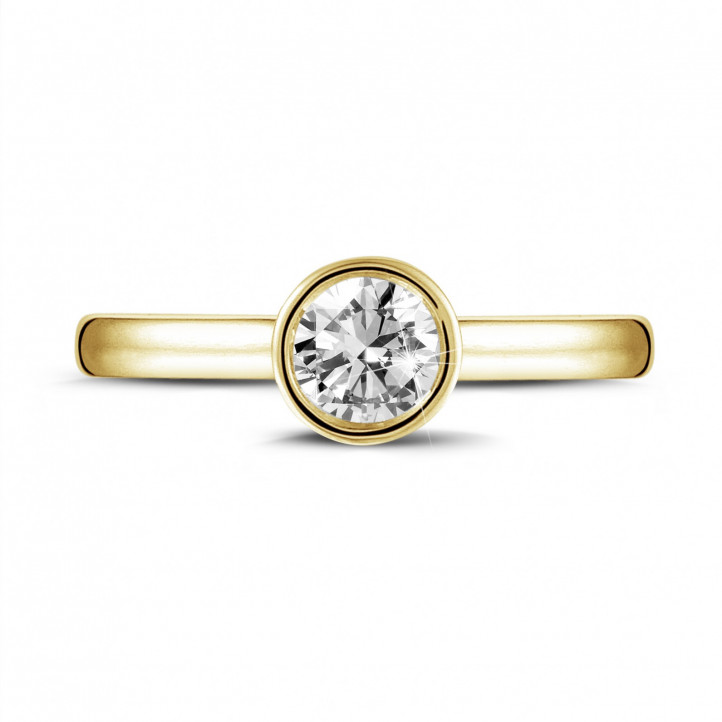 0.50 quilates anillo solitario en oro amarillo con un diamante redondo
