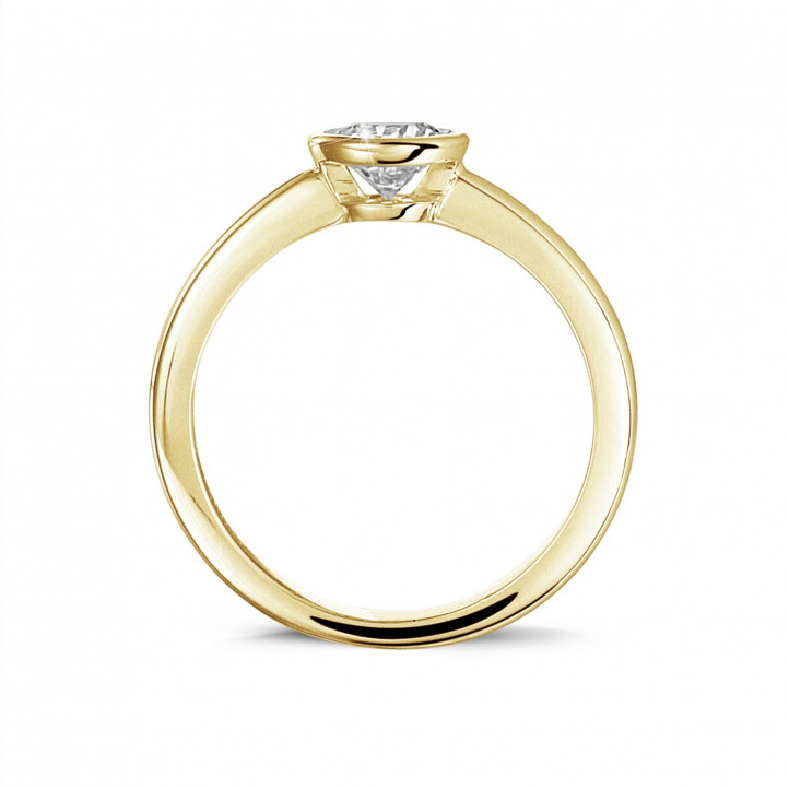 0.50 quilates anillo solitario en oro amarillo con un diamante redondo