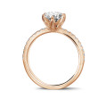 0.90 carat bague solitaire en or rouge avec diamants sur les côtés