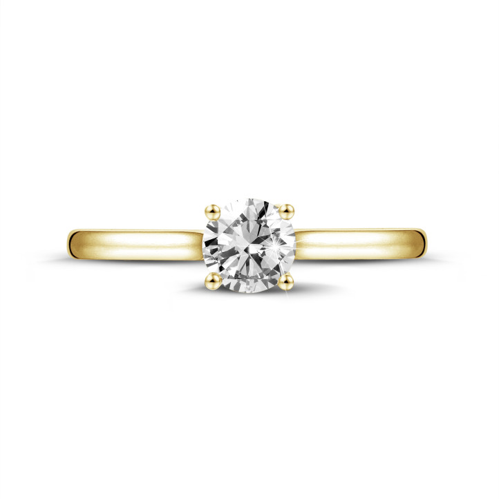 0.70 carats bague solitaire en or jaune avec un diamant rond et quatre griffes