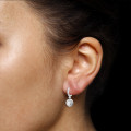 1.55 carat boucles d’oreilles auréoles en or blanc et diamants