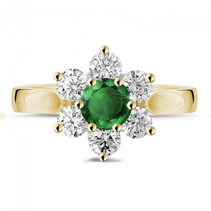 Bague fleur en or jaune avec une émeraude ronde et diamants sur les côtés