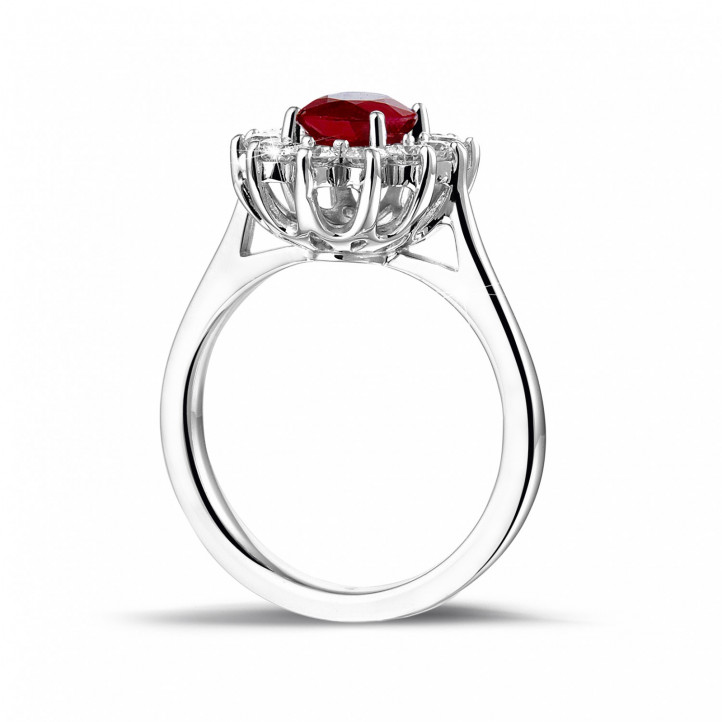 Bague entourage en platine avec un rubis ovale et diamants ronds