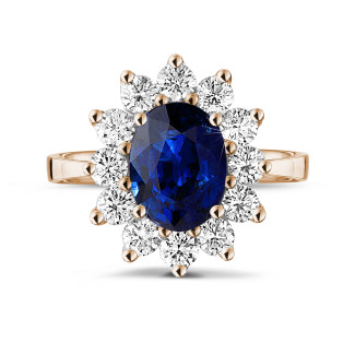 Bagues - Bague entourage en or rouge avec un saphir ovale et diamants ronds