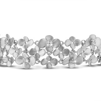 Bracelets - 0.75 carats bracelet design fleurs en or blanc avec diamants