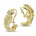 0.50 carats boucles d’oreilles design fleurs en or jaune avec diamants