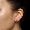 0.20 carat boucles d’oreilles design en or blanc et diamants