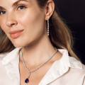 21.30 carat diamond gradient necklace in yellow gold with pear-shaped sapphire