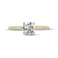 0.90 carat solitaire ring in yellow gold with side diamonds