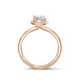 1.00Ct halo ring in red gold with oval diamond