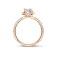0.70Ct halo ring in red gold with oval diamond